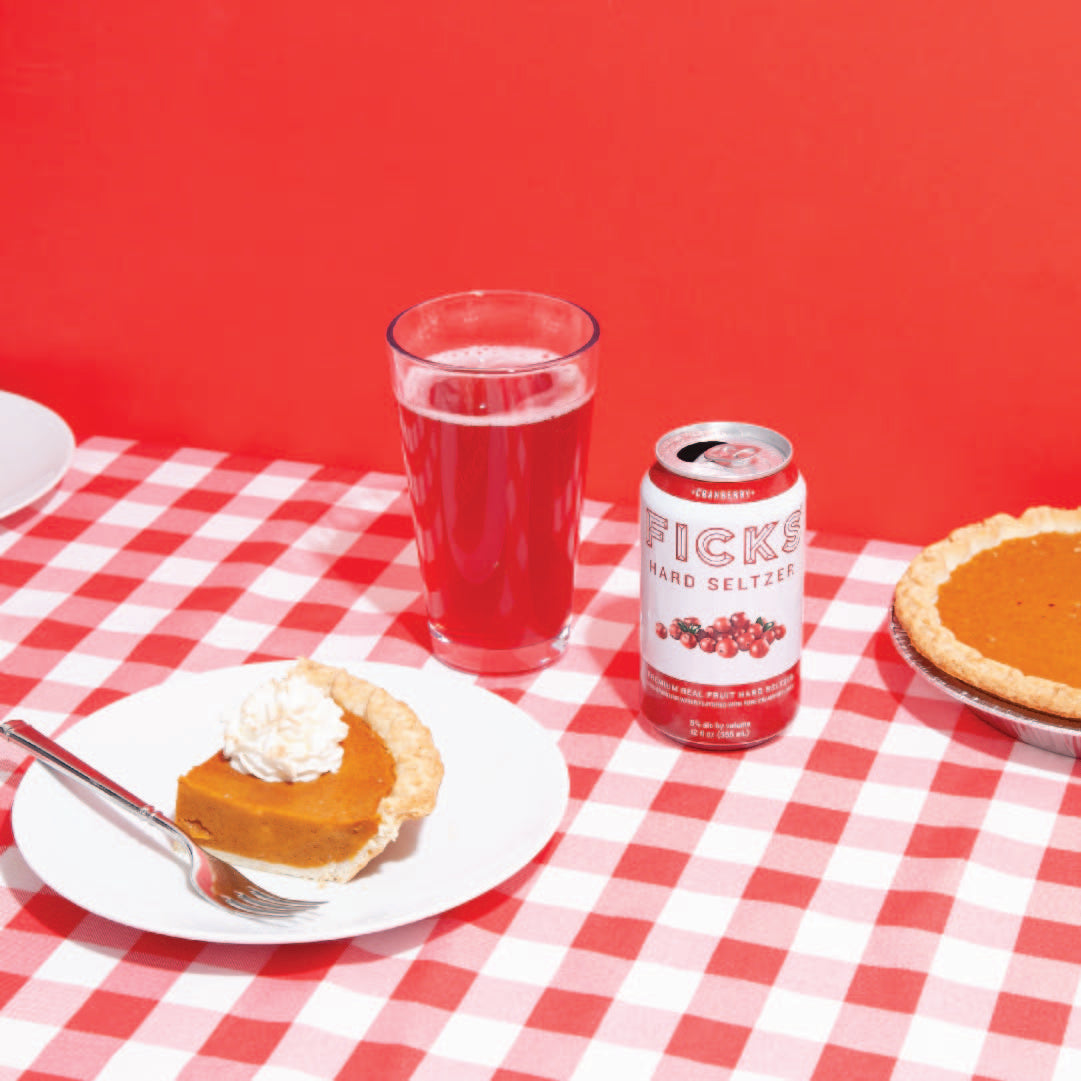 FICKS California made Hard Seltzer cranberry flavor on red Thanksgiving table with pumpkin pie.