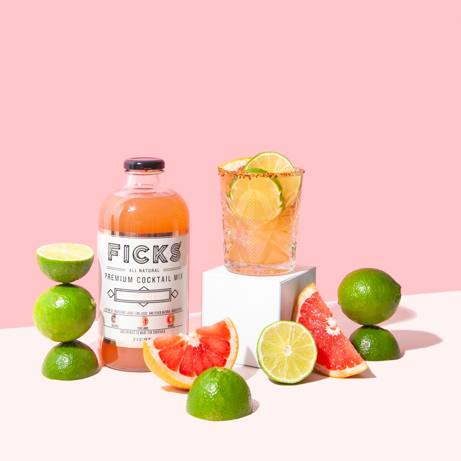 FICKS Paloma Cocktail Mixer with grapefruit wedges and Paloma cocktail in glass